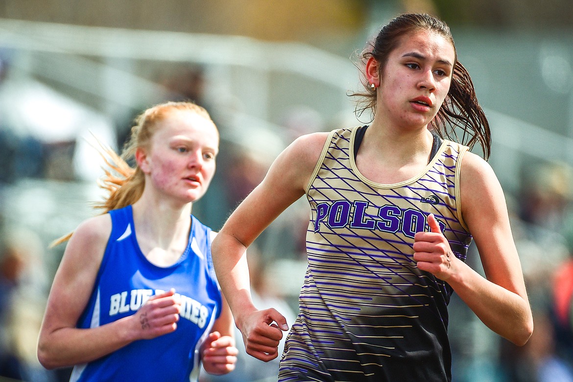 Polson's Ashtyn Wagner leads the girls 1600 meter run at the Whitefish ARM Invitational on Saturday, April 30. (Casey Kreider/Daily Inter Lake)