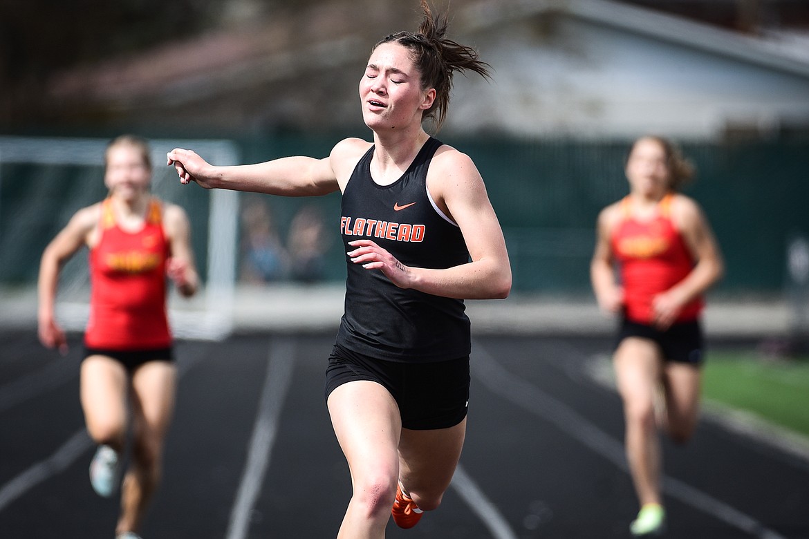 Flathead's Peyton Walker takes first in the girls 400 meter dash during a triangular meet with Missoula Hellgate and Missoula Sentinel at Legends Stadium on Tuesday, May 3. (Casey Kreider/Daily Inter Lake)