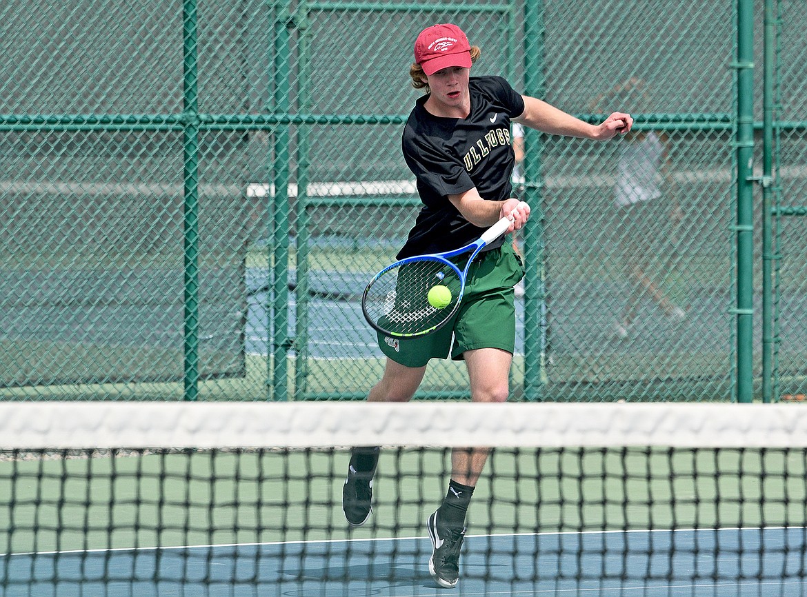 Whitefish senior Aaron Dicks approaches the net during a singles match against Flathead on Thursday at FVCC. (Whitney England/Whitefish Pilot)