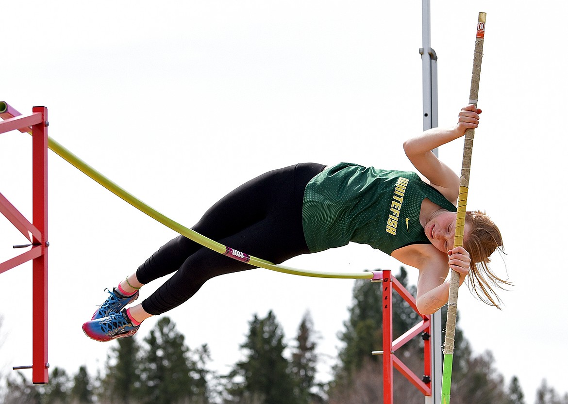 Whitefish freshman Georgia Morrell clears the mark in pole vault at the Whitefish ARM on Saturday. (Whitney England/Whitefish Pilot)