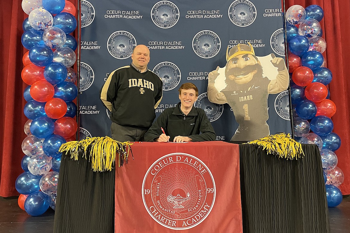 Coeur d'Alene Charter Academy Senior Luke Zawis signed a letter of intent to attend the University of Idaho. He is pictured with Vice Principal Aaron Lippy.