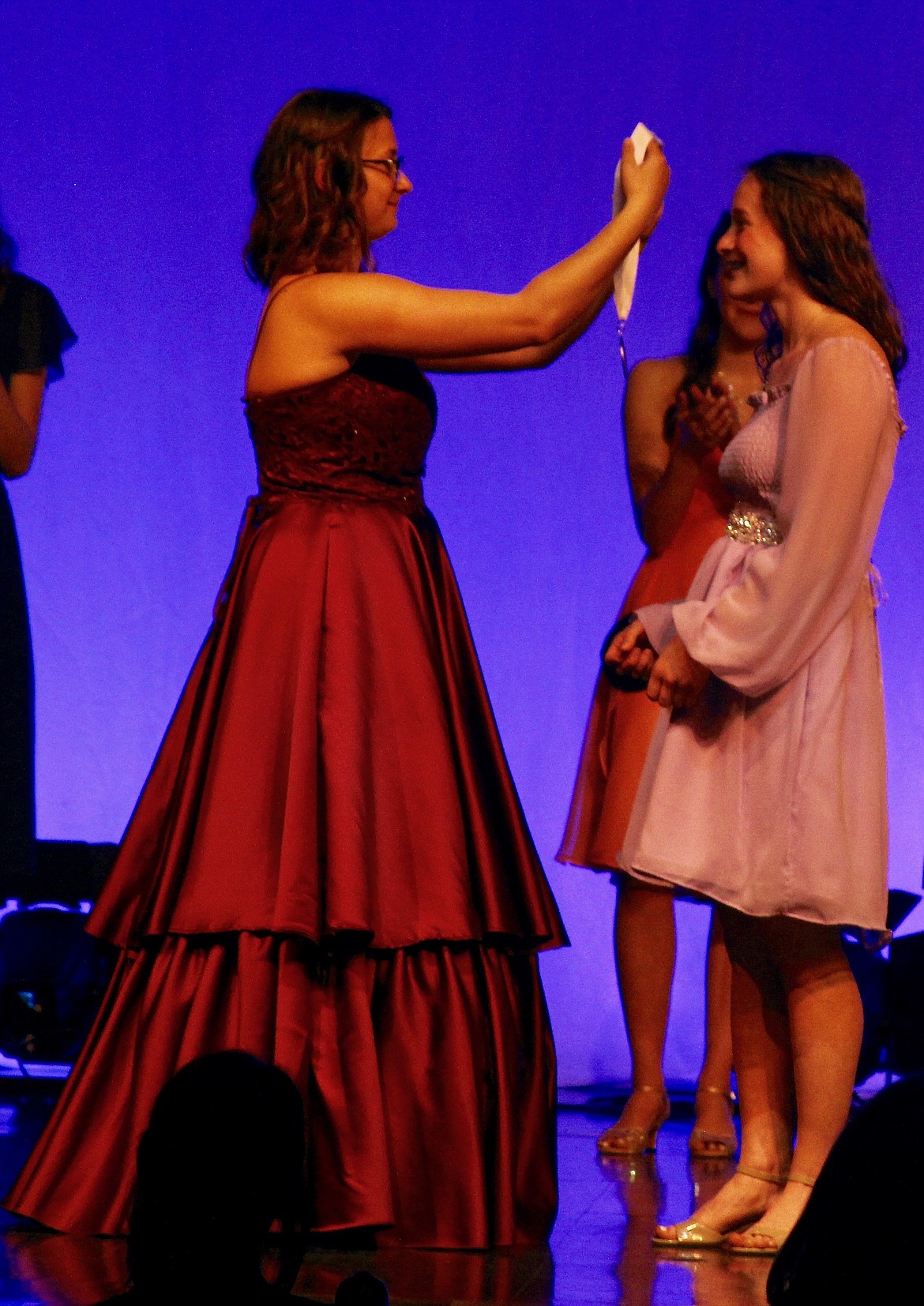 (left) Cali Iacolucci bestows the DYW medal to Leah Moellmer.