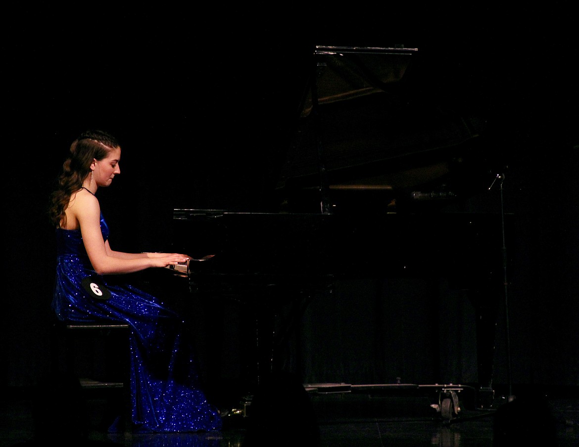 Emma Lucas performs a piano solo for the talent portion of the DYW 2022 program.