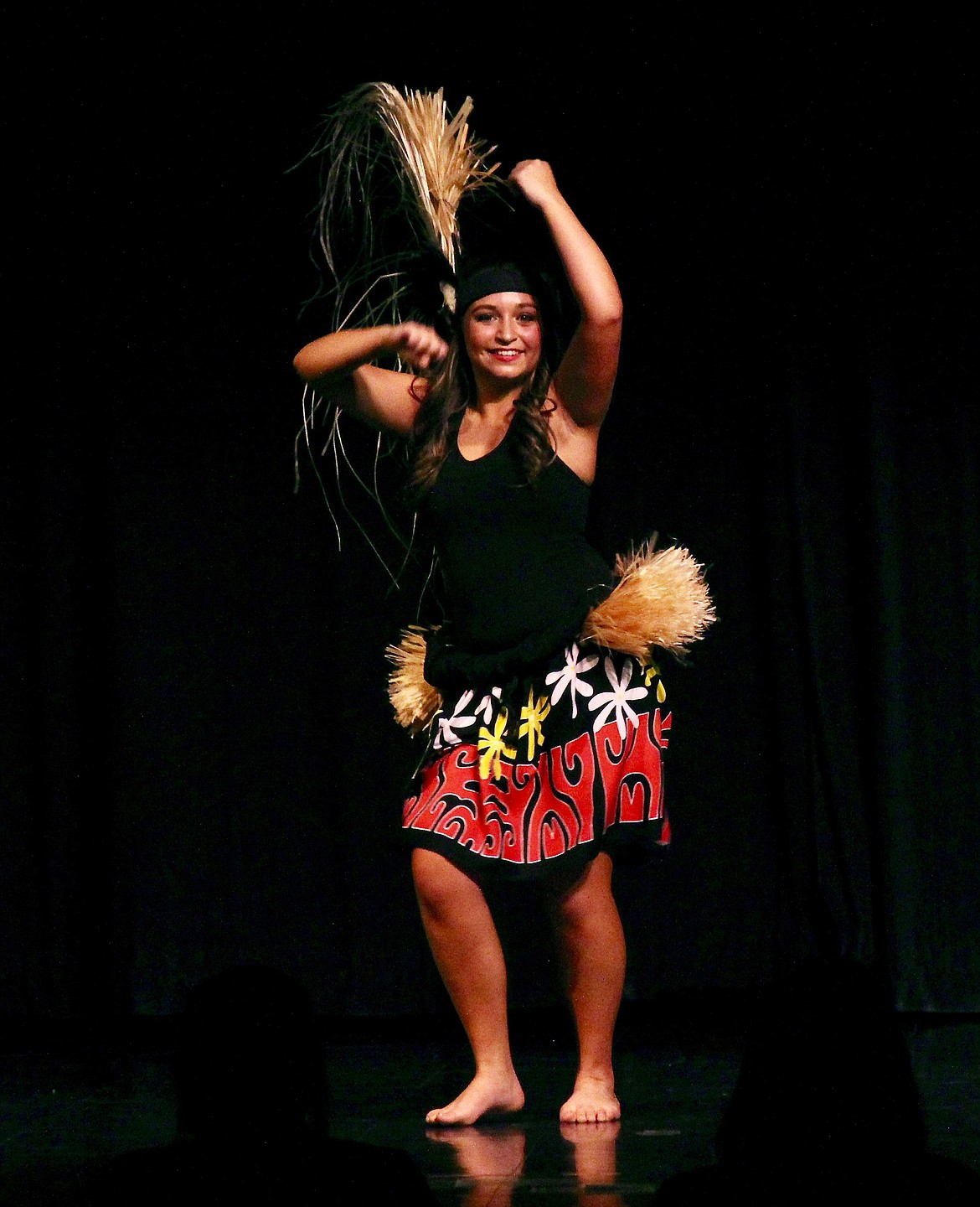 Maile Murdock shows off her dance skills with a Tahitian dance during the talent portion of the DYW 2022 scholarship program.