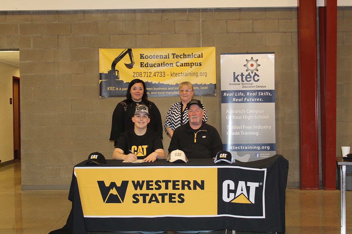Wyatt Todd, a KTEC and Lake City High School senior, signed a letter of intent with Western States Caterpillar on Tuesday. He's seen here with Western States Equipment Hayden branch manager Brian Berger, seated; mom Stacy Stephenson, standing left; and grandma Colleen Taylor.