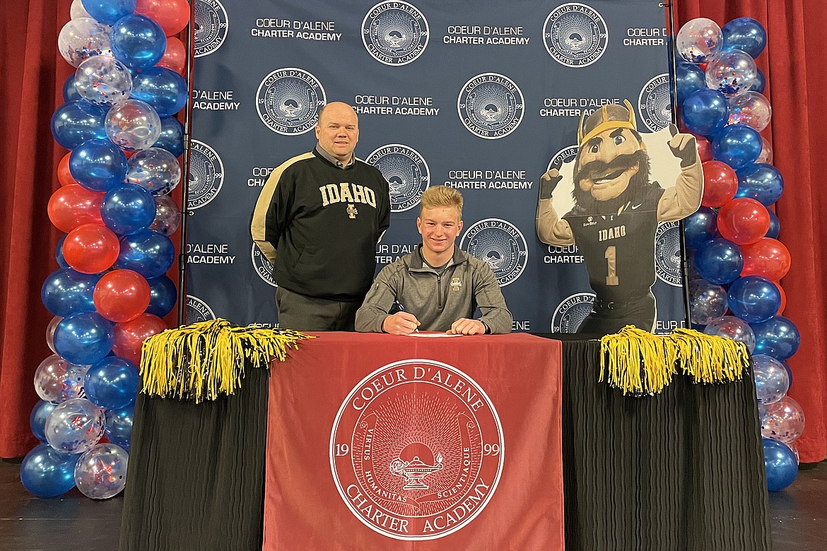 Coeur d'Alene Charter Academy senior Taylor Hancock signed a letter of intent on April 14 to attend the University of Idaho. He's pictured here with Vice Principal Aaron Lippy.