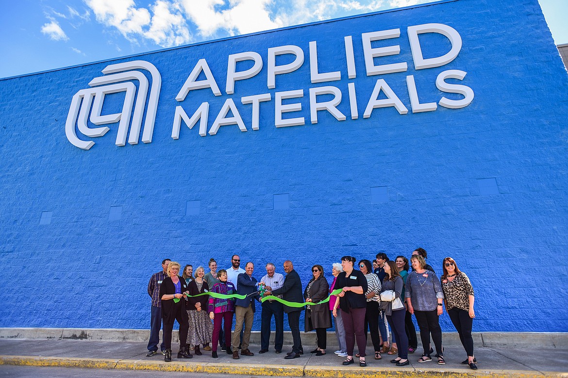 Officials cut a ribbon outside the Applied Materials building in Evergreen on Wednesday, May 4. (Casey Kreider/Daily Inter Lake)