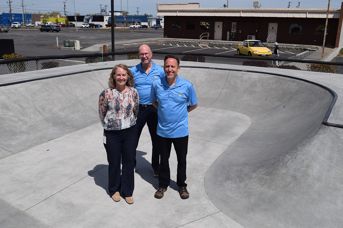 Moses Lake City Director of Parks, Recreation and Cultural Services Susan Schwiesow, current Rotary Club of Moses Lake President Terry Leas, and past-president of the Rotary Club of Moses Lake Steven Ausere pose in the new concrete bowl at the Moses Lake Skate Park. The club raised over $160,000 to pay for the bowl’s construction, as well as the addition of LED lights for night skating.