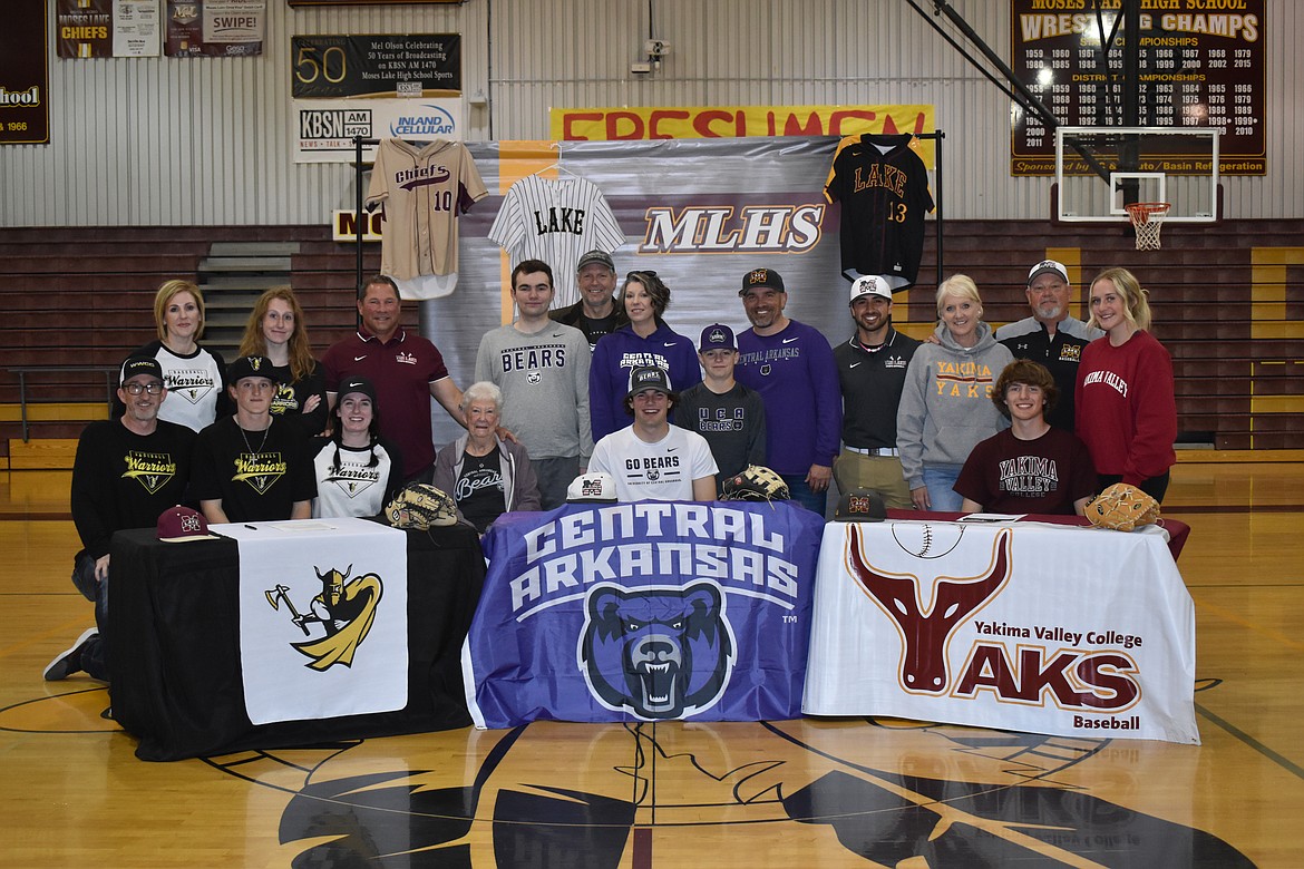 The three Moses Lake High School seniors signed their commitment letters surrounded by their coaches and families.