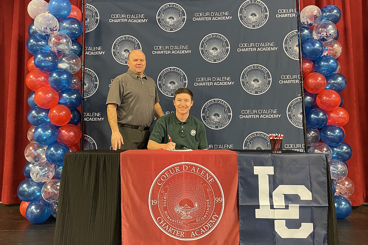 Coeur d'Alene Charter Academy senior Ethan Samayoa signed a letter of intent to attend Lewis-Clark State College in Lewiston. He's pictured with Vice Principal Aaron Lippy.