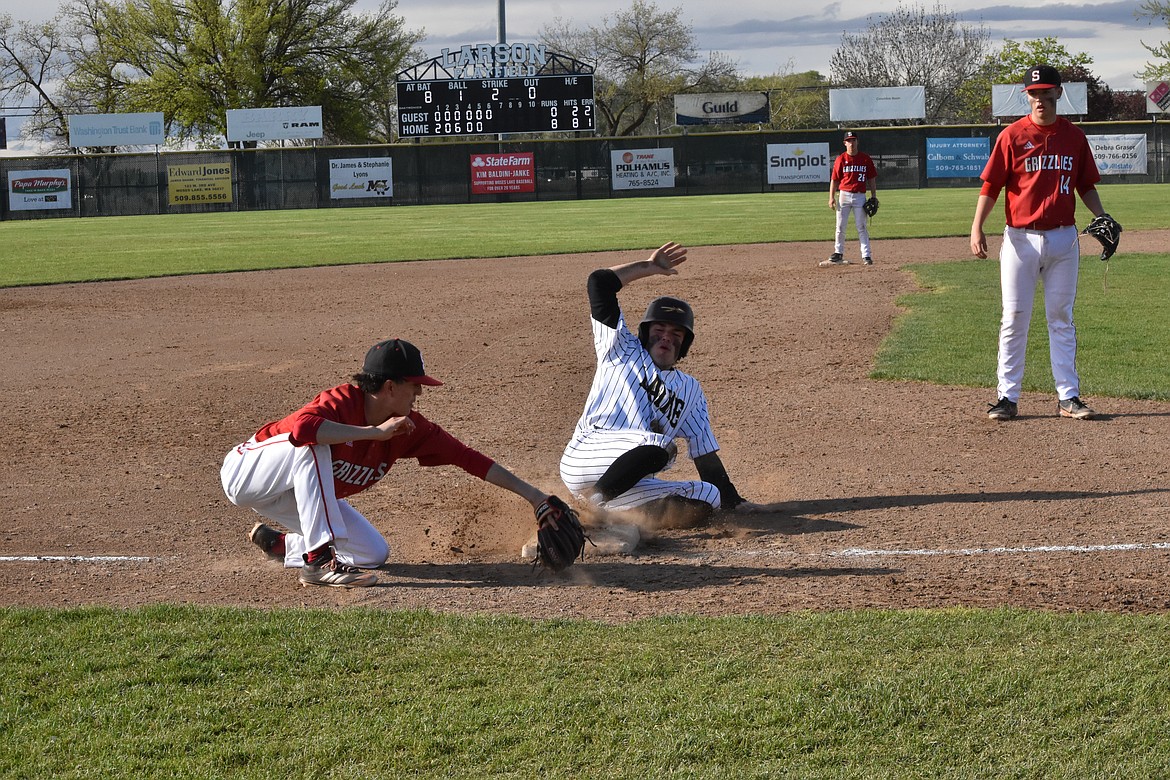 Moses Lake High School senior Jackson Purcell slides into third base during the league matchup against Sunnyside High School on Friday.