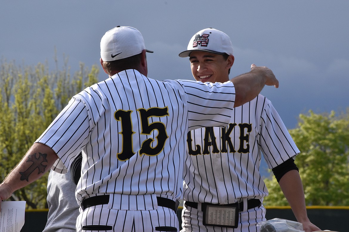 Chiefs Senior Jacob Martinez hugs head coach Donnie Lindgren during the senior recognition ceremony on Friday.