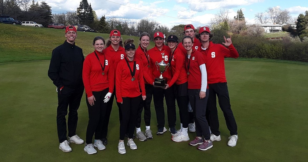 The Sandpoint golf team celebrates after the Class 4A district 1 golf tournament at the University of Idaho's golf course on Monday.