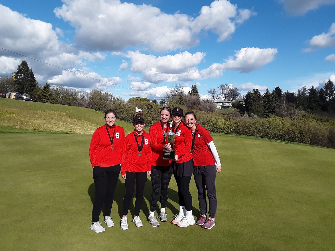 The Sandpoint girls golf team celebrates after winning the Class 4A district 1 golf tournament at the University of Idaho's golf course on Monday.