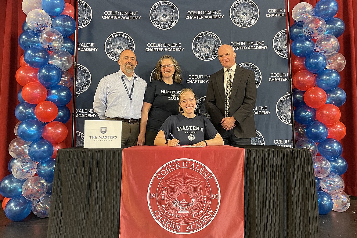 Coeur d'Alene Charter Academy senior Emma Bird signed a letter of intent to attend the Master's University in Santa Clarita, Calif. Pictured are Scott and Diana Bird, Emma and Charter Principal Dan Nicklay.