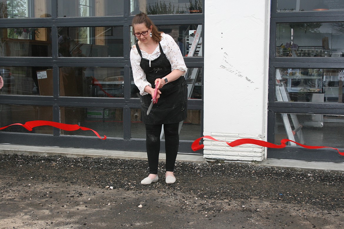 Cow Path Bakery co-owner Janice Baginski cuts the ribbon on the official grand opening day Friday at the bakery’s permanent location in Othello. Baginski began the business as a catering company from her home in 2020.