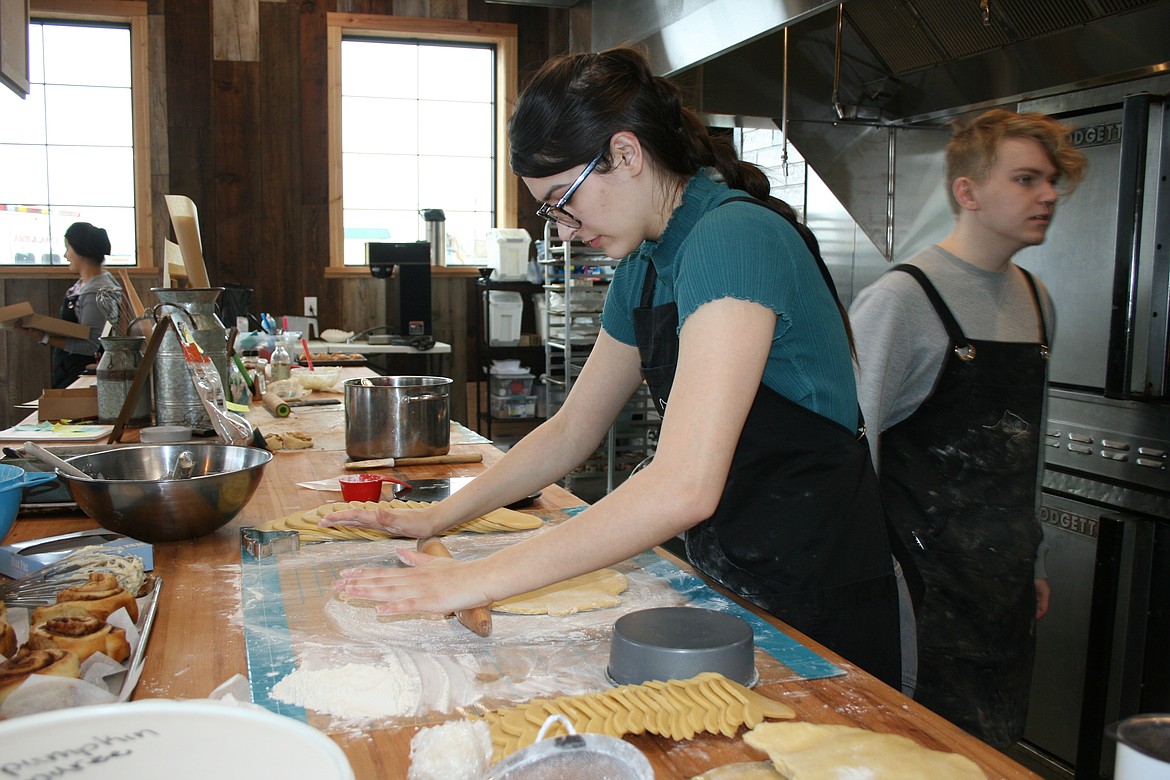 Cow Path Bakery employee Meah Michel rolls dough for raspberry galettes (a single-crust pie not baked in a pan) on the bakery’s official grand opening.