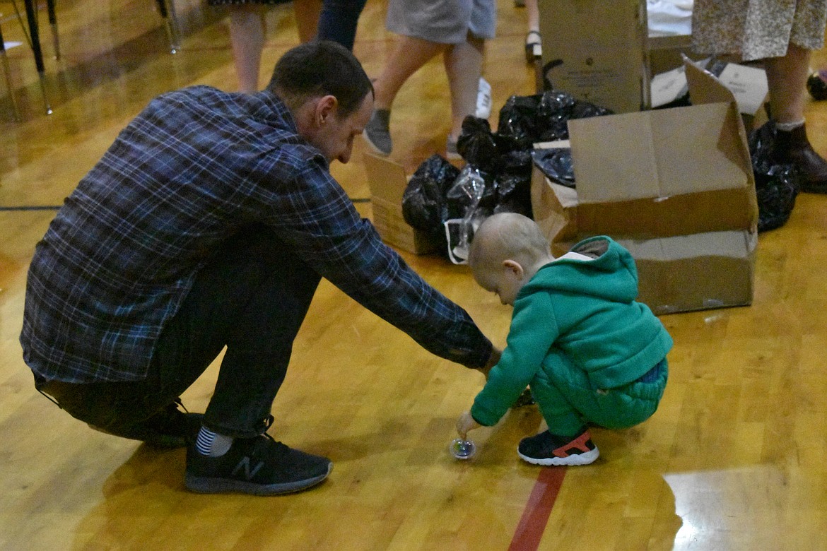 There were children’s toys for refugees to pick out and some, like this child and his father, were eager to try them out. Many young refugees came to the area with little more than one backpack full of essentials.