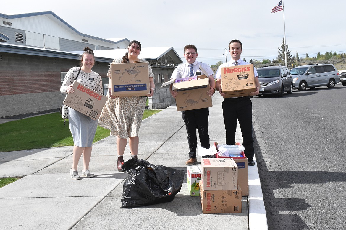 Church of Latter Day Saints missionaries were one of many organizations and individuals to take part in a drive to help Ukrainian refugees that have come to Grant County. From left to right, Sister Jessica Haderlie, Sister Lucy Hammons, Elder Ryan Hancock and Elder Spencer Meyers.