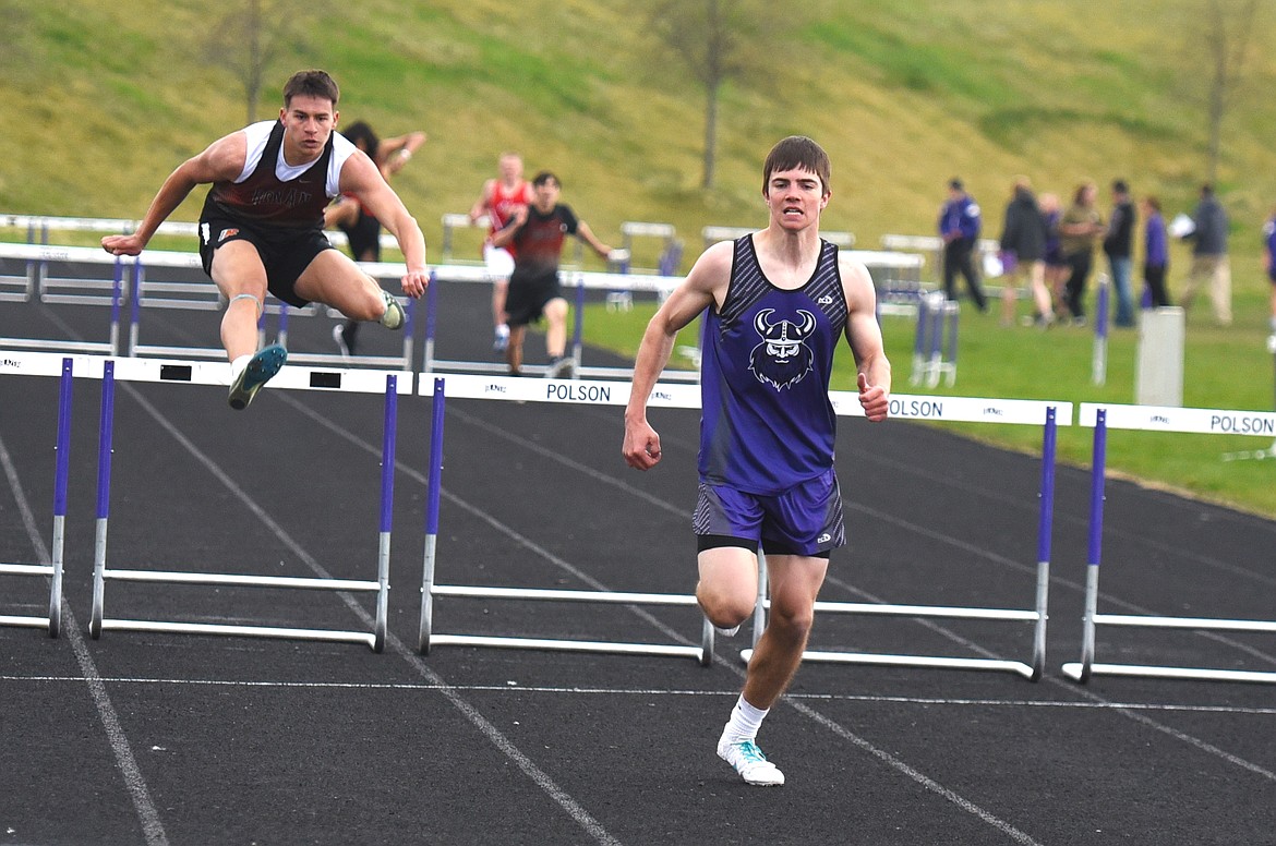 Charlo's Coyle Nagy won the 300-meter hurdles, while Rueben Couture of Ronan was second. (Scot Heisel/Lake County Leader)
