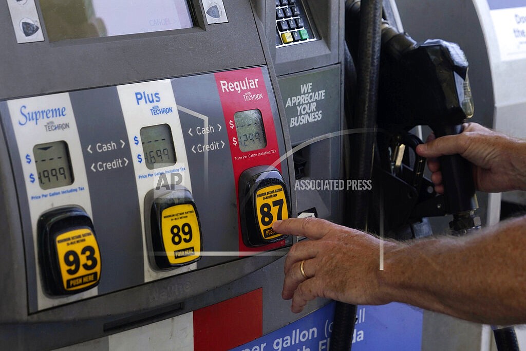 A customer pumps gas at an Exxon gas station, Tuesday, May 10, 2022, in Miami. U.S consumers have so far defied higher prices for gas, food, and rent and have been spending more in 2022, providing crucial support to the economy. How long that can continue will be one of the key factors affecting the economy and inflation this year. (AP Photo/Marta Lavandier)