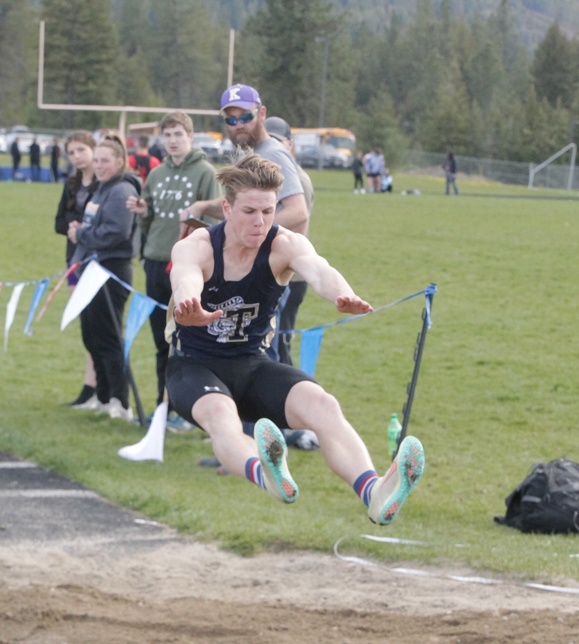 JASON ELLIOTT/Press
Timberlake's Kale Paslay lands his long jump attempt during the 3A District 1 meet, which began Wednesday at Timberlake High. The event concludes today at Timberlake starting at 4 p.m.