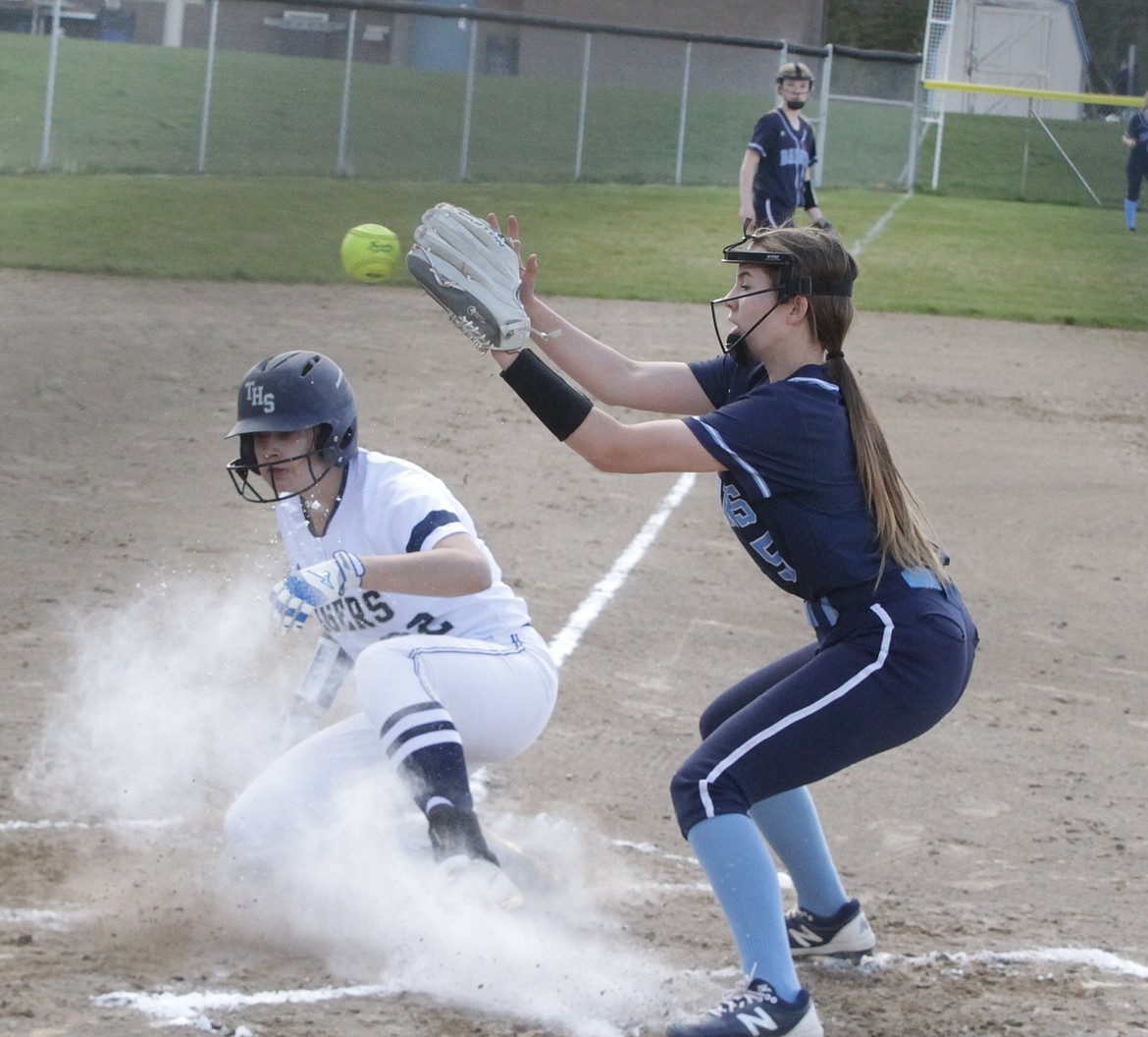 JASON ELLIOTT/Press
Timberlake junior Topanga Rojas slides into home safely after a wild pitch in the first inning of Wednesday's 3A District 1 softball opener against Bonners Ferry.