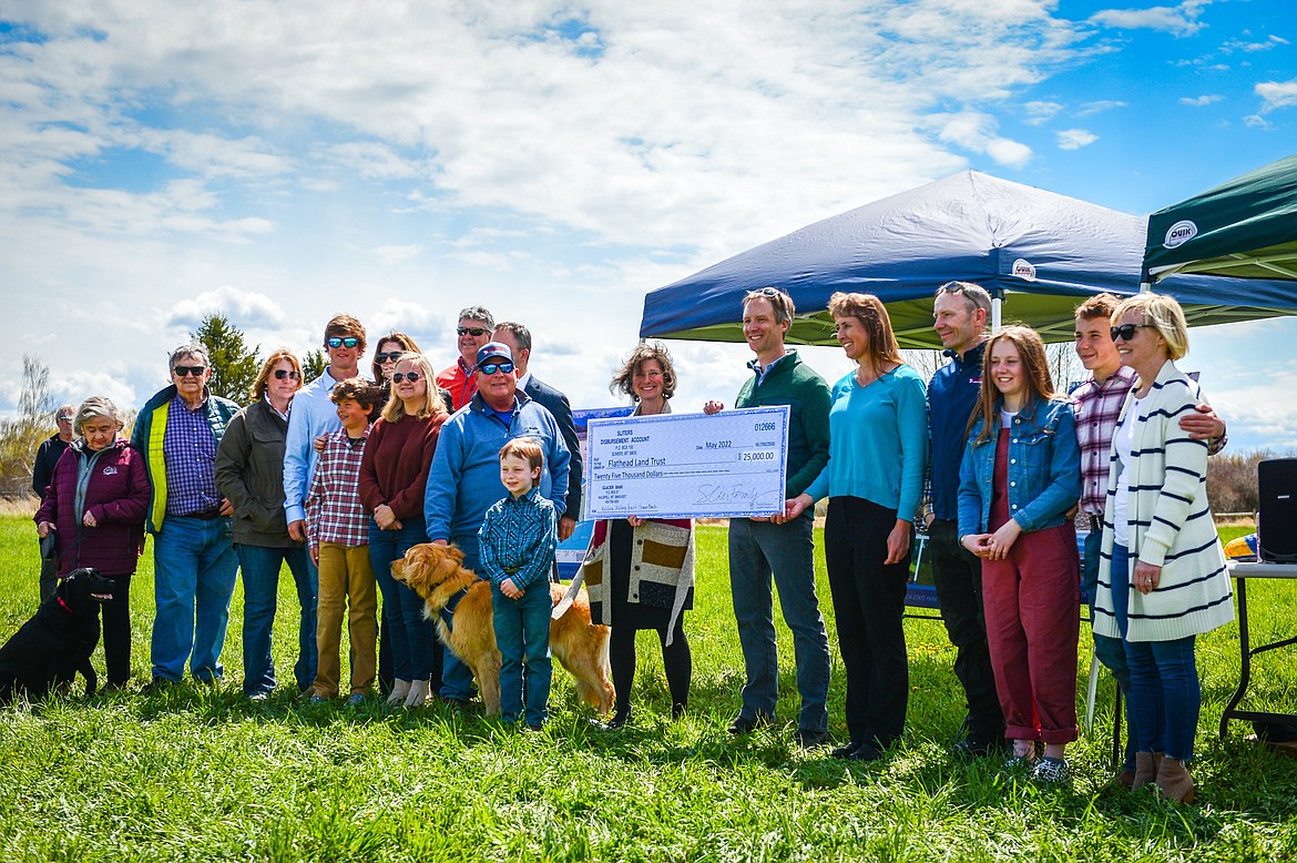 A check is presented from the Sliter family to the Montana State Parks Foundation during a ribbon-cutting ceremony at Somers Beach State Park on Thursday, May 12. (Casey Kreider/Daily Inter Lake)