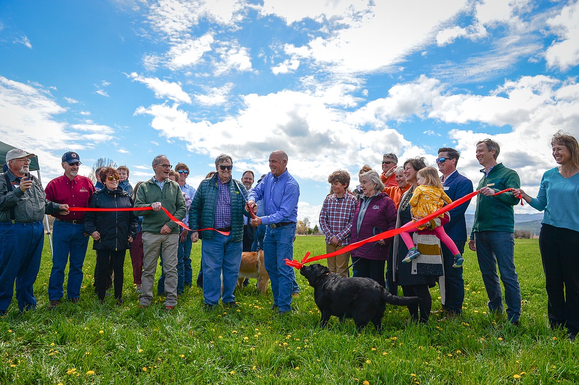 Gov. Greg Gianforte, members of the Sliter family and other officials cut a ribbon at a ribbon-cutting ceremony at Somers Beach State Park on Thursday, May 12. (Casey Kreider/Daily Inter Lake)