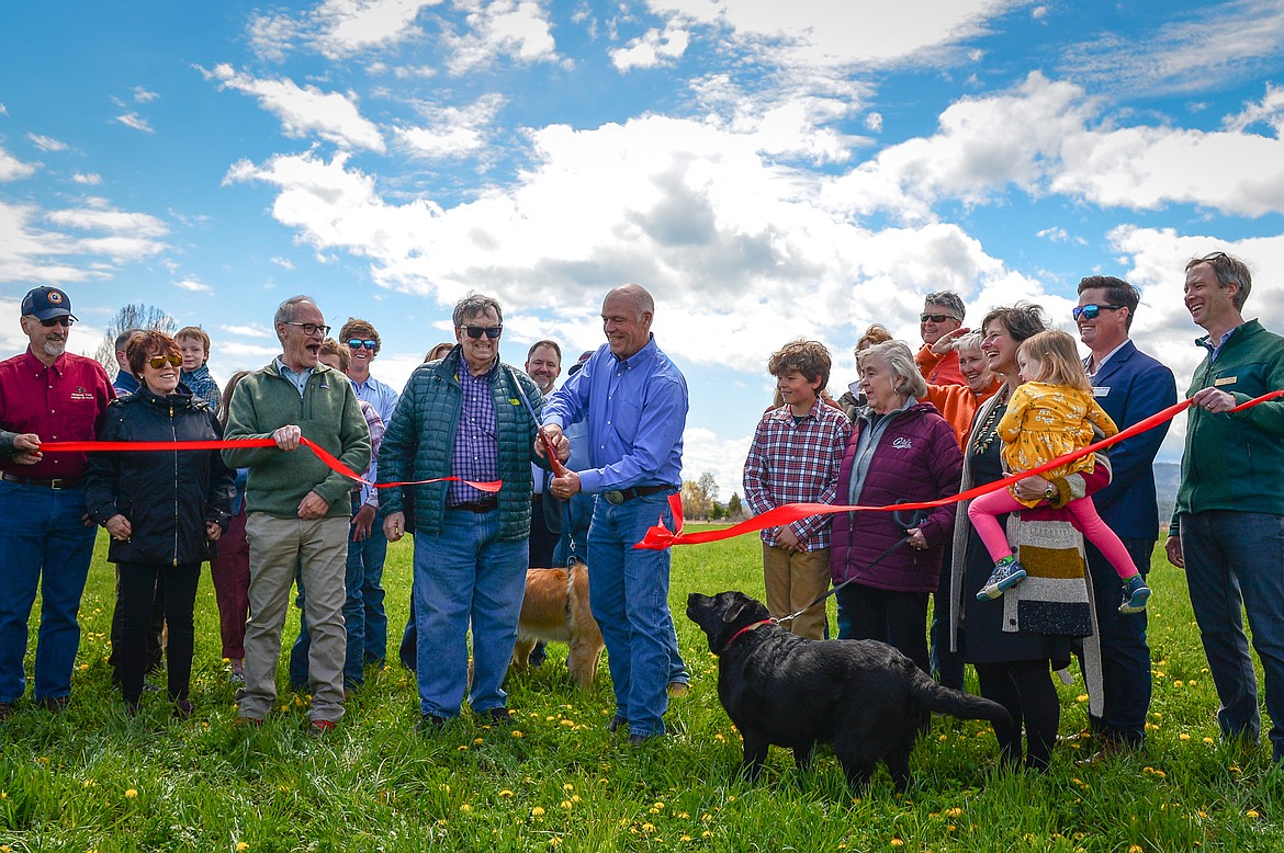 Gov. Greg Gianforte, members of the Sliter family and other officials cut a ribbon at a ribbon-cutting ceremony at Somers Beach State Park on Thursday, May 12. (Casey Kreider/Daily Inter Lake)