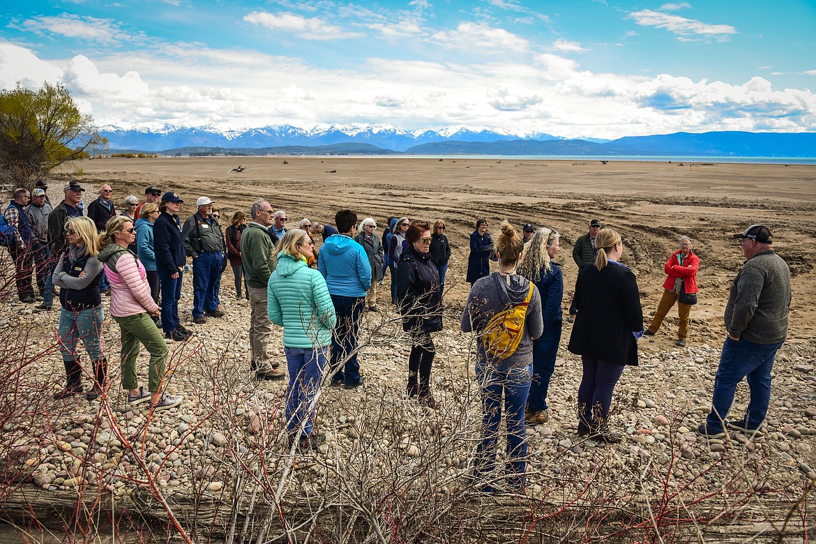 Attendees walk out to the beach along Flathead Lake after a ribbon-cutting ceremony at Somers Beach State Park on Thursday, May 12. (Casey Kreider/Daily Inter Lake)