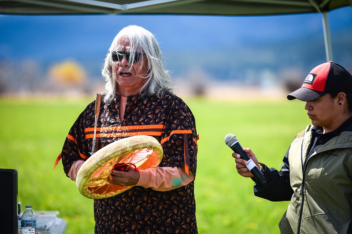Tribal Elder Louis Caye Jr. of the Confederated Salish and Kootenai Tribes sings a ceremonial song after giving a speech at a ribbon-cutting ceremony at Somers Beach State Park on Thursday, May 12. (Casey Kreider/Daily Inter Lake)