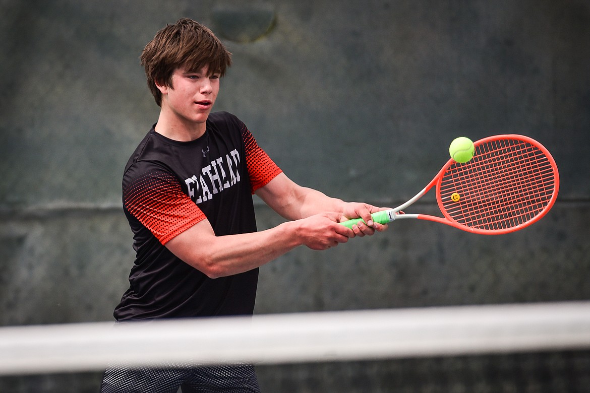 Flathead's Kutuk White hits a backhand return against Glacier's Will Rudbach at Flathead Valley Community College on Thursday, May 12. (Casey Kreider/Daily Inter Lake)