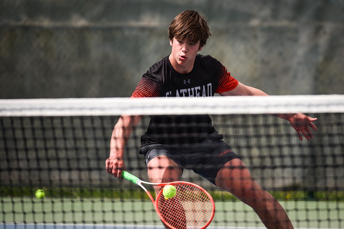 Flathead's Kutuk White hits a backhand return against Glacier's Will Rudbach at Flathead Valley Community College on Thursday, May 12. (Casey Kreider/Daily Inter Lake)