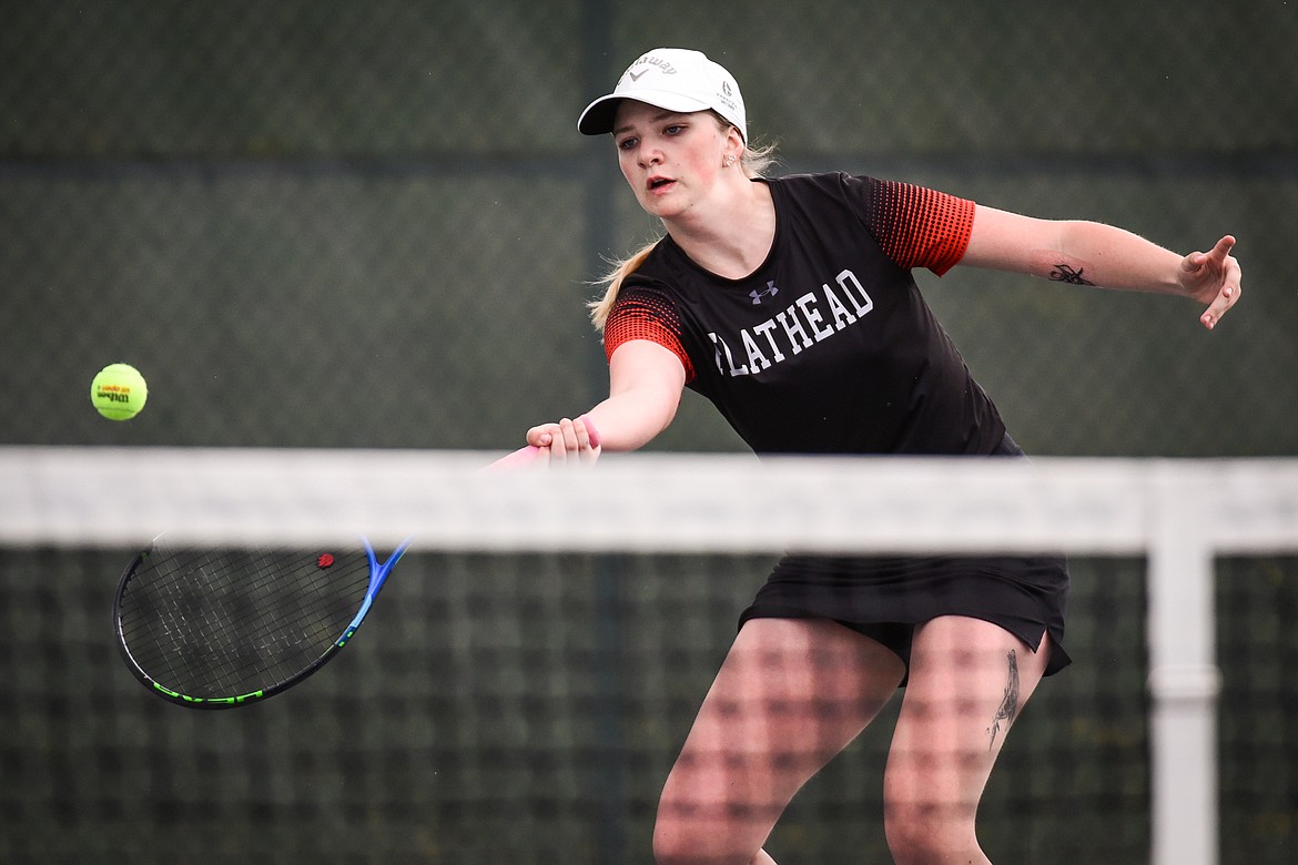 Flathead's Sophia Dykhuizen reaches for a return in a doubles match with teammate Abby Clark against Glacier's Haven Speer and Sarah Downs at Flathead Valley Community College on Thursday, May 12. (Casey Kreider/Daily Inter Lake)