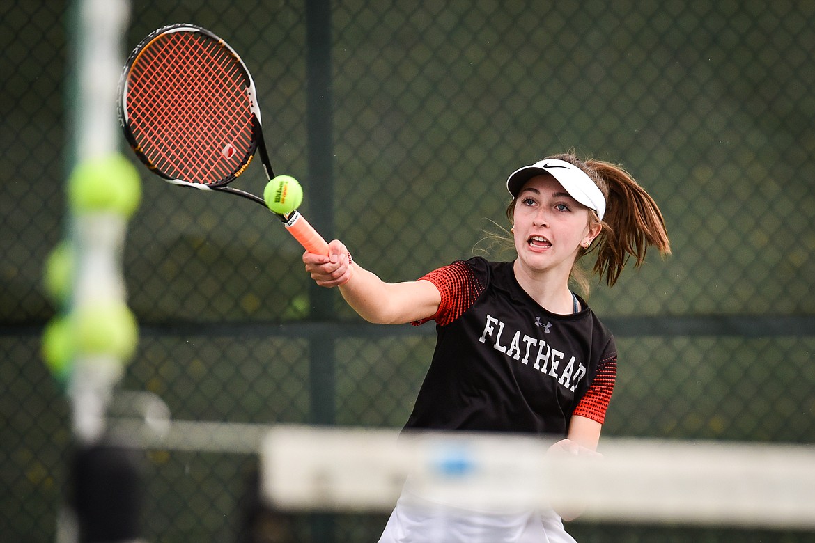 Flathead's Abby Clark hits a return in a doubles match with teammate Sophia Dykhuizen against Glacier's Haven Speer and Sarah Downs at Flathead Valley Community College on Thursday, May 12. (Casey Kreider/Daily Inter Lake)