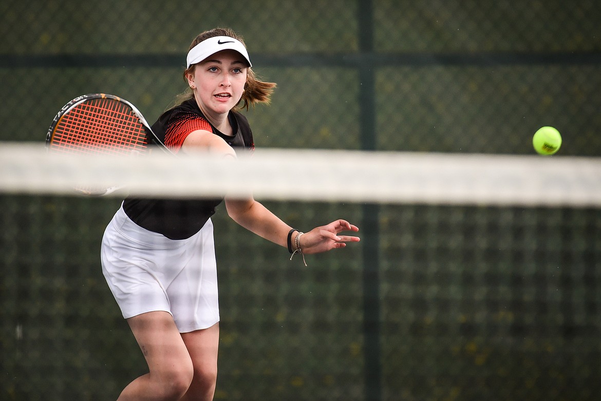 Flathead's Abby Clark hits a return in a doubles match with teammate Sophia Dykhuizen against Glacier's Haven Speer and Sarah Downs at Flathead Valley Community College on Thursday, May 12. (Casey Kreider/Daily Inter Lake)