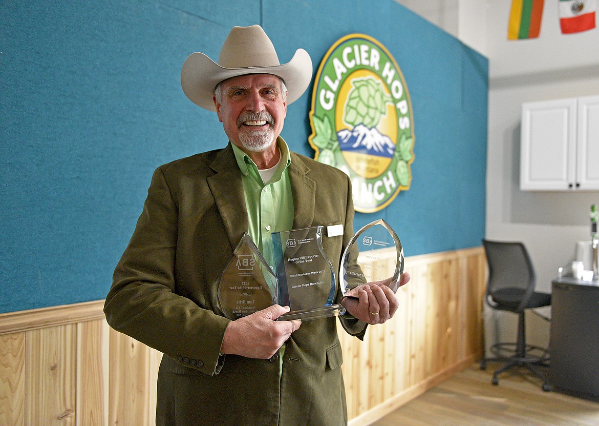 Tom Britz, Founder and CEO of Glacier Hops Ranch in Whitefish, accepts the state, regional and national Exporter of the Year awards from the Small Business Administration. (Whitney England/Whitefish Pilot.)