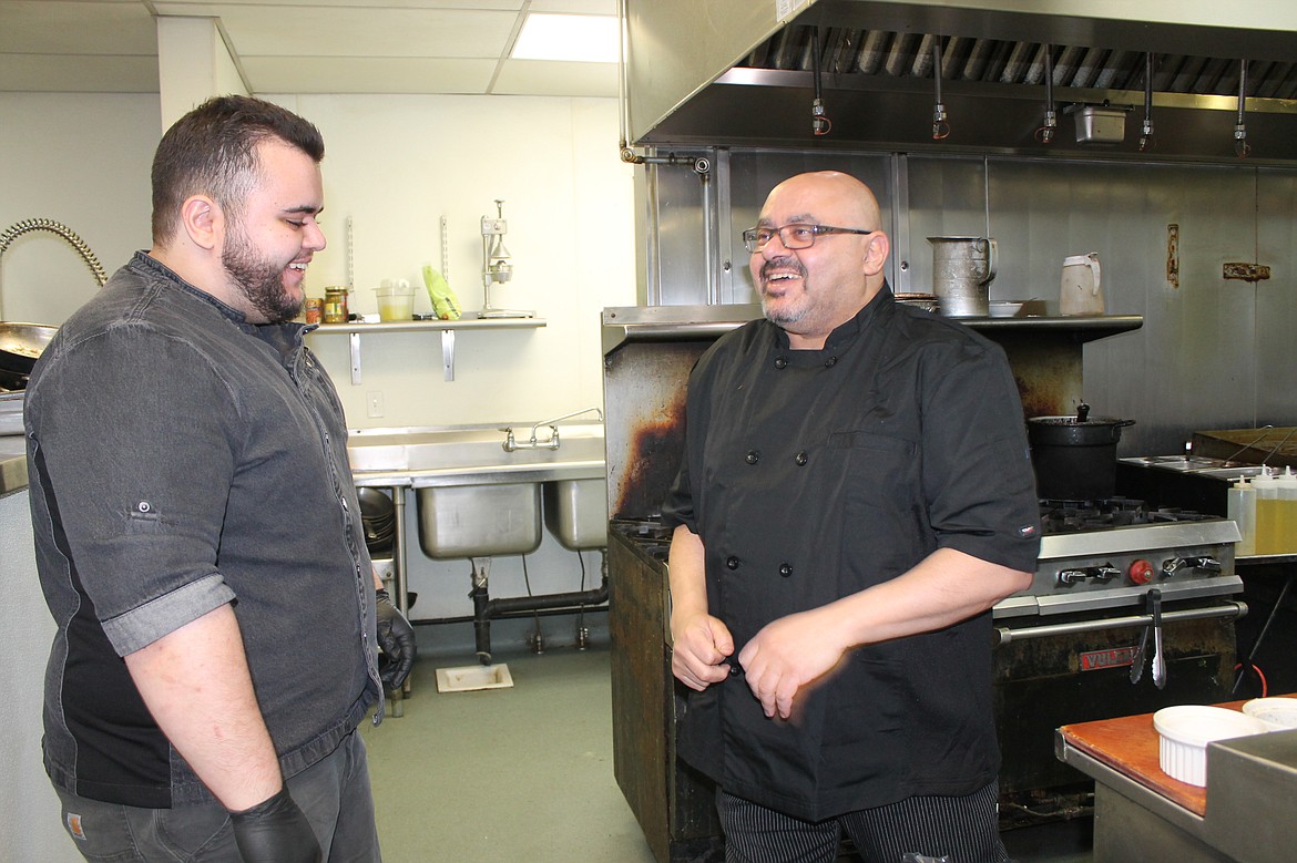 Pillar Rock Grill head chef Sameh Farag (right) talks with staff member Isaiah Farag at the restaurant Wednesday. Chefs don’t simply cook food, they also manage and run the kitchen to ensure prompt, high-quality service.