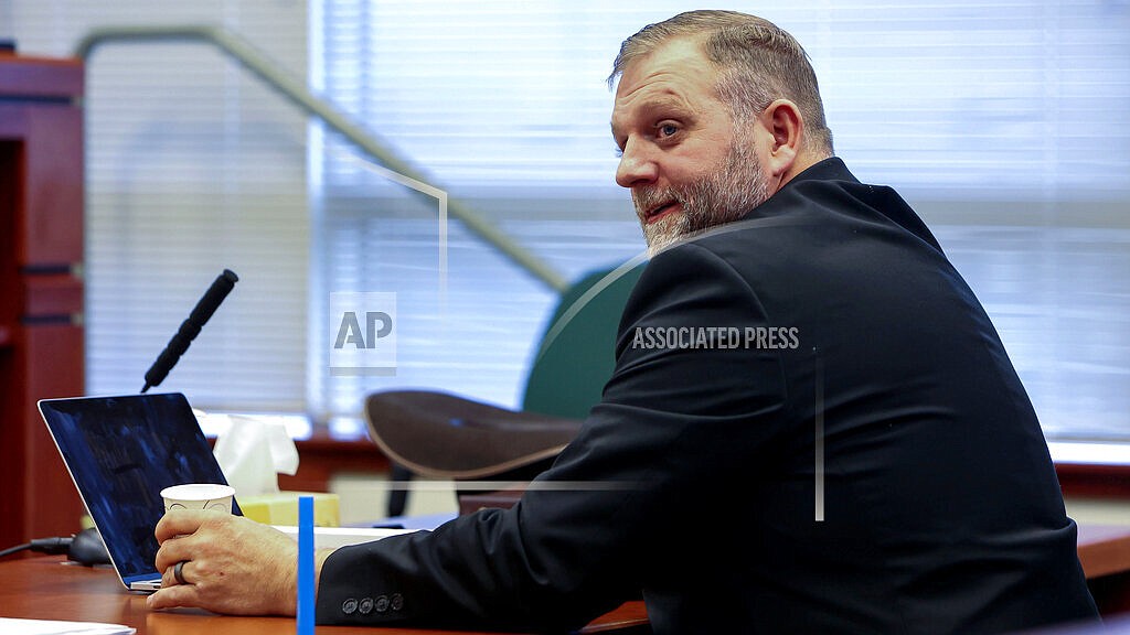 Ammon Bundy glances toward the prosecution table during a pause in his trial to clarify a line of questioning with the jury dismissed in Ada County Magistrate Judge Kim Dale's courtroom Tuesday, March 15, 2022, in Boise, Idaho. An Idaho hospital that went on lockdown in March after far-right activists protested outside is suing Bundy, Diego Rodriguez and their various political organizations for defamation and “sustained online attacks." St. Luke’s Health System filed the lawsuit Wednesday, May 11 against Bundy, his gubernatorial campaign, and the People’s Rights Network organization. (Darin Oswald/Idaho Statesman via AP, File)