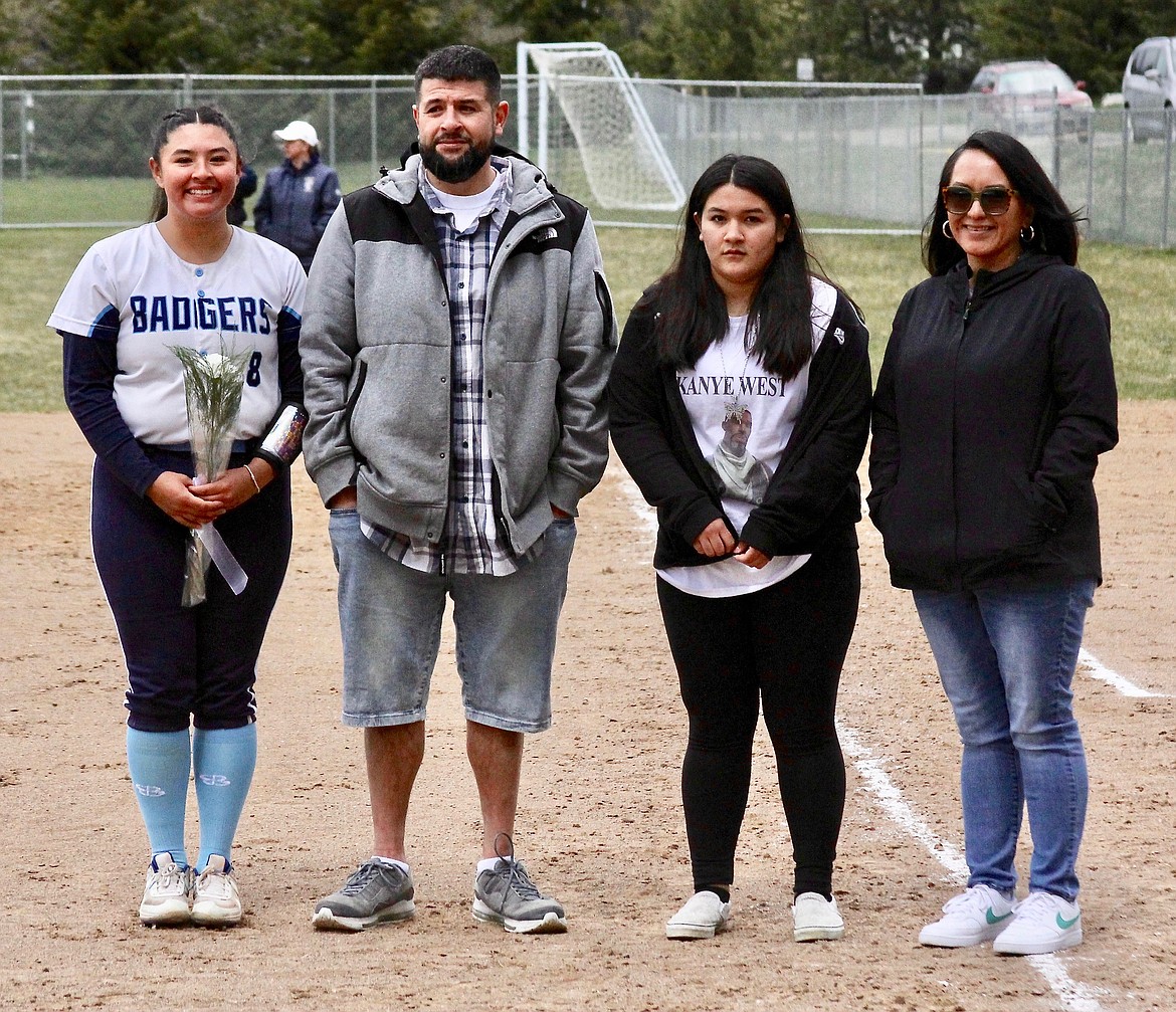 (left) Marisa Shottanana-Ponce and her family are honored at softball senior night.