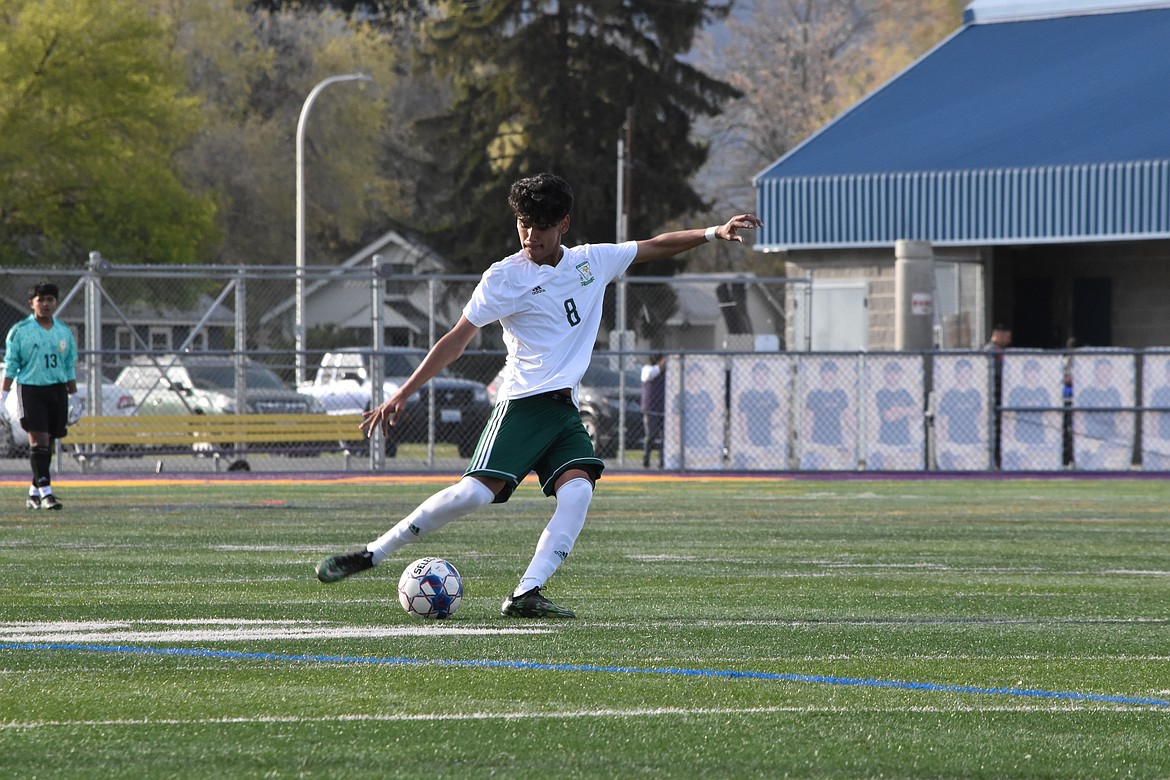 Junior Isaac Lopez (8) kicks the ball during the district matchup against Bridgeport on Wednesday.