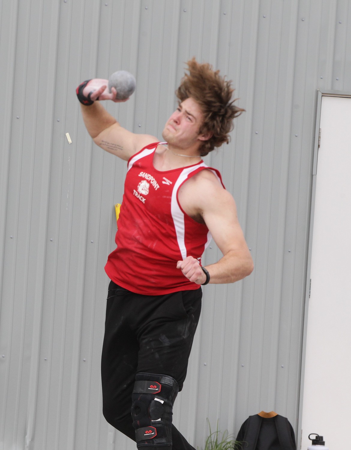 Sandpoint senior Will Hurst winds up for his final throw in the shot put during the 4A Region 1 meet at Coeur d'Alene High. Hurst won the event with a throw of 52 feet, 6 1/2 inches.