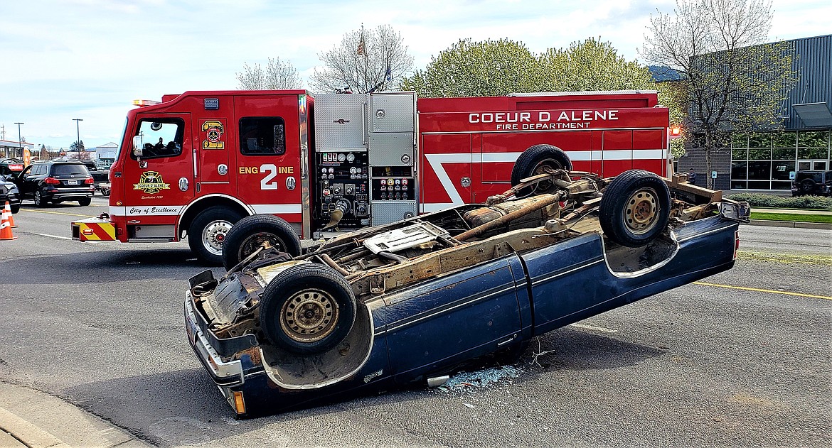 Photo by Joe Weihert
A car flipped over at Government Way and Sunset Avenue on Thursday. The driver suffered minor injuries.