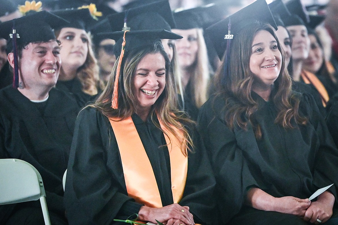 Graduates laugh during a commencement speech by Joe Legate, retired faculty of the Humanities Division, at Flathead Valley Community College's 54th commencement ceremony on Friday, May 13. A total of 304 graduates earned 319 degrees and certificates. (Casey Kreider/Daily Inter Lake)