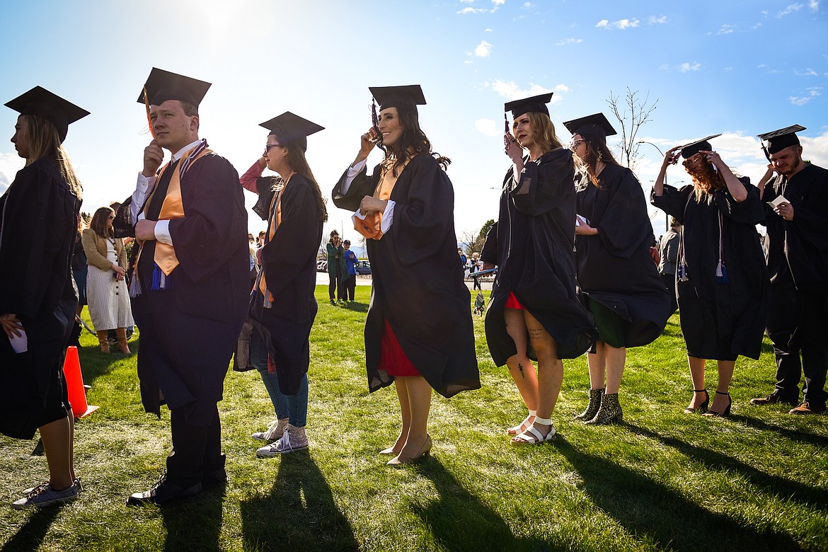 Graduates file across campus and into the big tent at the Flathead Valley Community College Class of 2022 commencement ceremony on Friday, May 13. A total of 304 graduates earned 319 degrees and certificates (Casey Kreider/Daily Inter Lake)