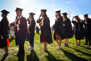 Graduates file across campus and into the big tent at the Flathead Valley Community College Class of 2022 commencement ceremony on Friday, May 13. A total of 304 graduates earned 319 degrees and certificates (Casey Kreider/Daily Inter Lake)