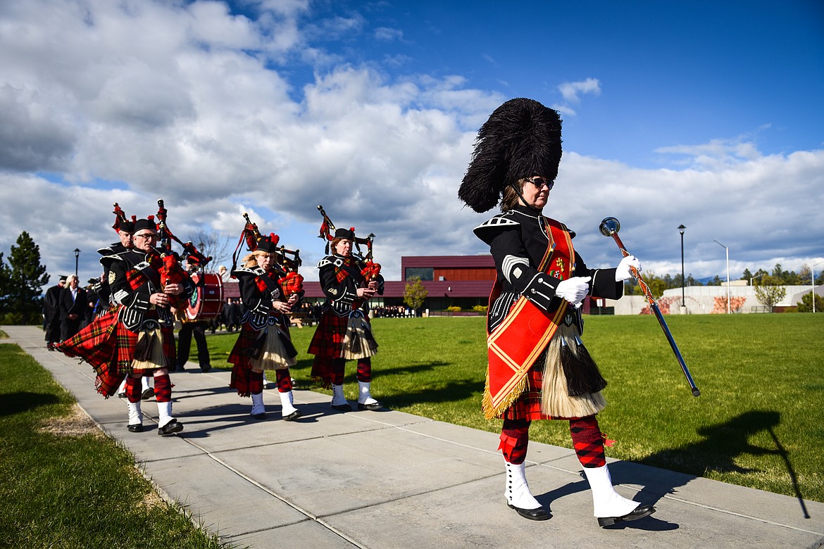 The Montana Highlanders lead the processional at the Flathead Valley Community College Class of 2022 commencement ceremony on Friday, May 13. (Casey Kreider/Daily Inter Lake)