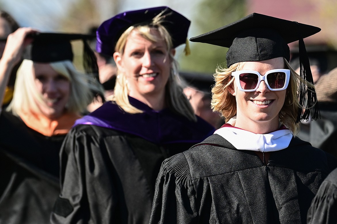 Graduates walk across campus during the processional at the Flathead Valley Community College Class of 2022 commencement ceremony on Friday, May 13. (Casey Kreider/Daily Inter Lake)