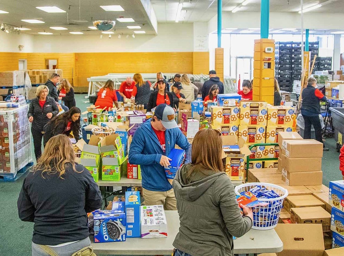 Volunteers organize snacks for the Flathead Snack Packing Program. (Courtesy photo)